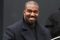 Kanye West in black coat
