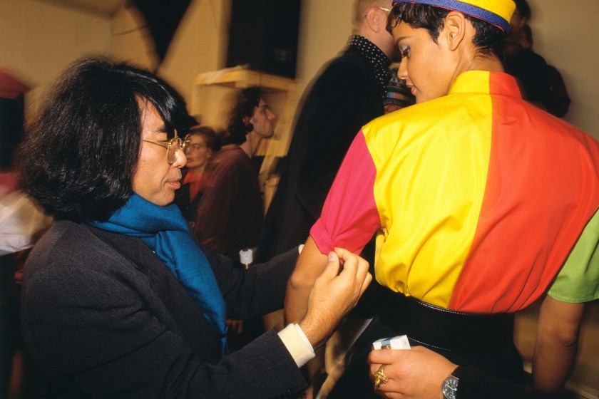 Designer Kenzo backstage with models during the 1992 Ready-to-Wear Fall-Winter fashion show. (Photo by John van Hasselt/Sygma via Getty Images)