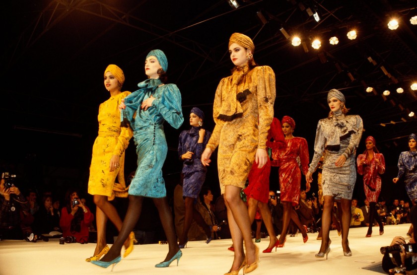 Fashion models wear bright colored suits with matching turbans by Japanese fashion designer Kenzo Takada at his autumn-winter 1986-1987 fashion show in Paris. Kenzo presented his women's ready-to-wear collection at the show. (Photo by Pierre Vauthey/Sygma/Sygma via Getty Images)